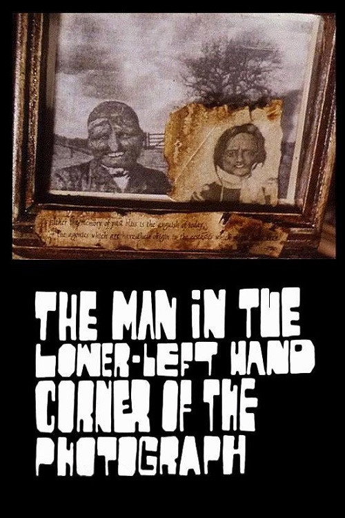 The Man in the Lower-Left Hand Corner of The Photograph постер